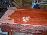 a red glossy finish when red gum timber is oiled